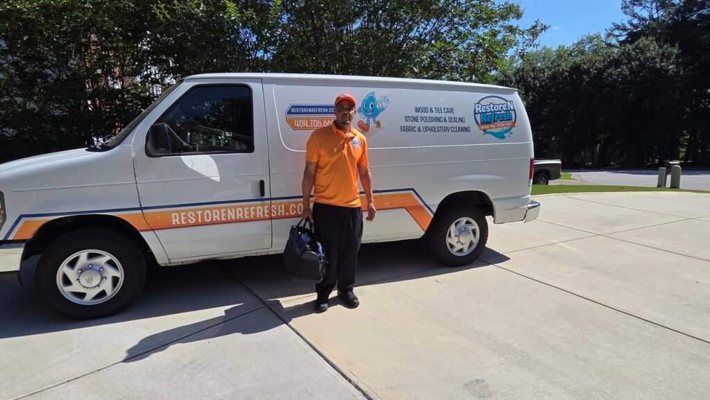Restore N Refresh owner standing beside the branded service van